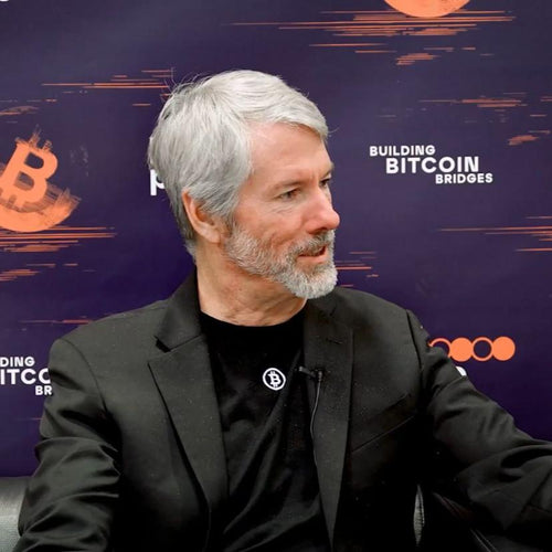 Micheal Saylor wearing Bitcoin emblem T-shirt