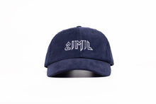 Load image into Gallery viewer, A navy blue corduroy 21mil cap with embroidered logo.
